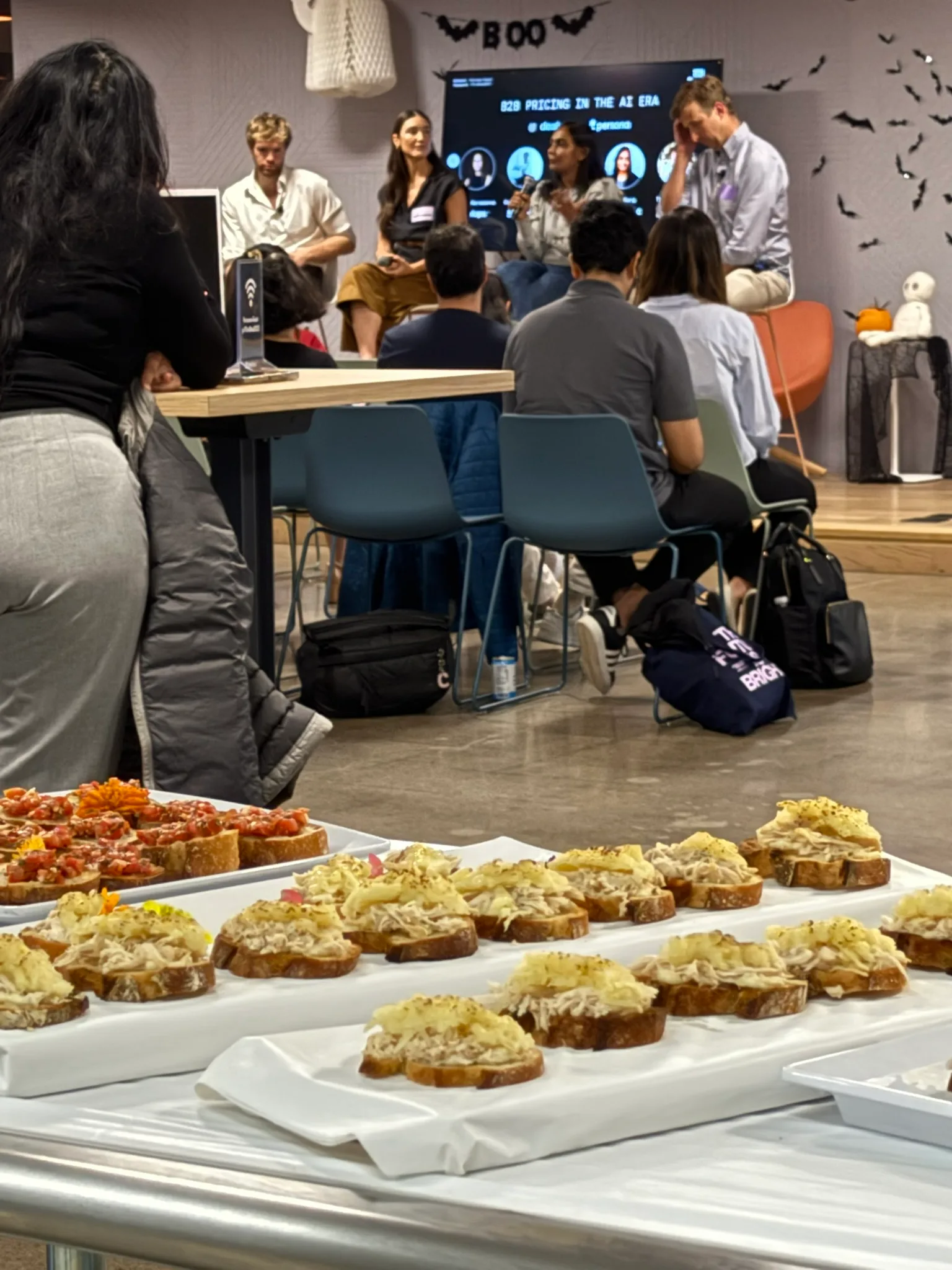 Catering spread at a corporate tech event with crostini and bruschetta